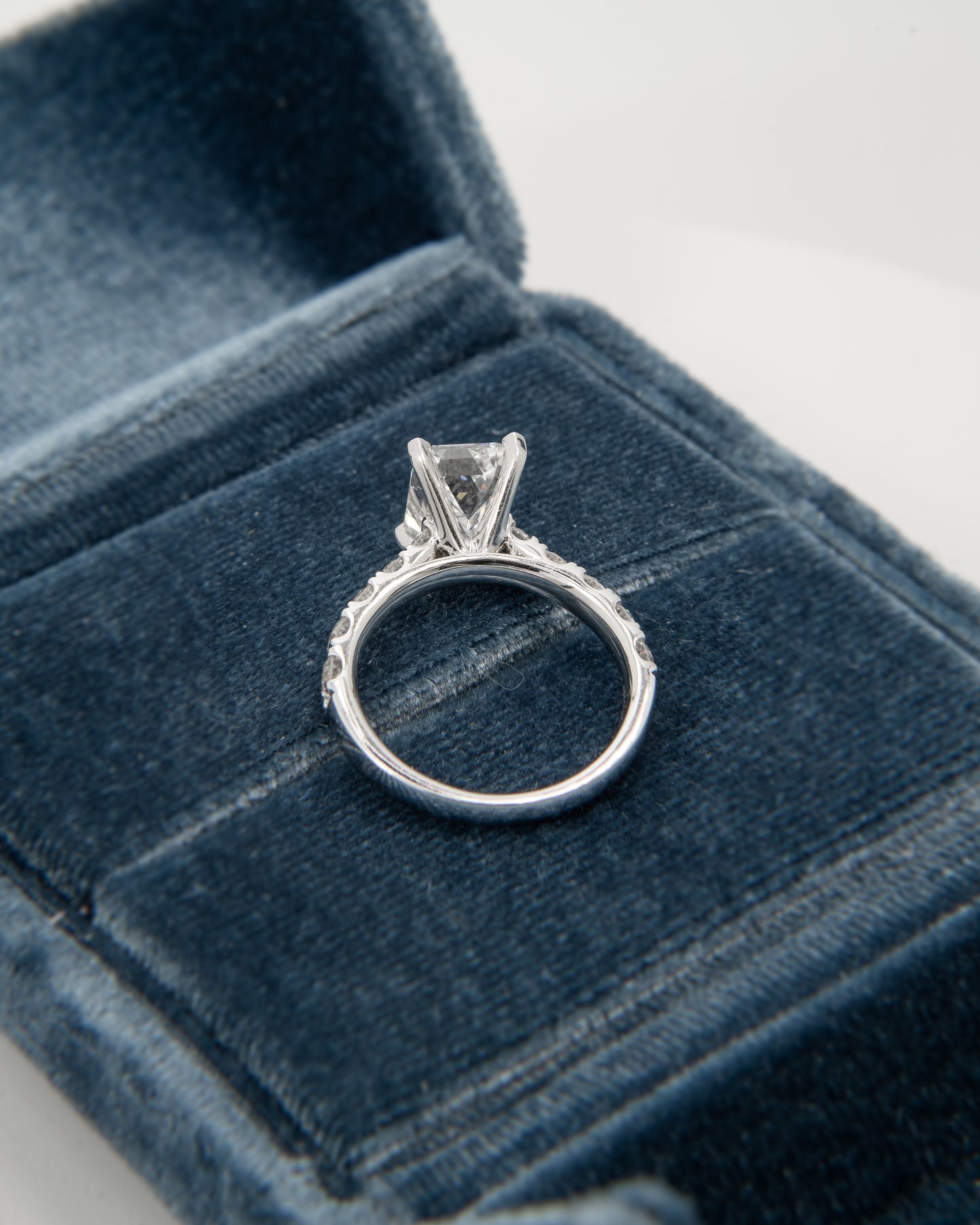 18kt 3ct emerald cut ring 1/2 pave